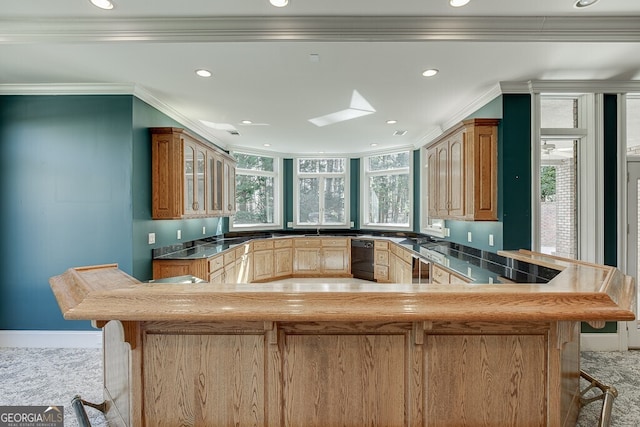 kitchen featuring light colored carpet, ornamental molding, and kitchen peninsula