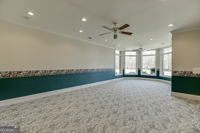 empty room featuring light carpet, ceiling fan, and ornamental molding