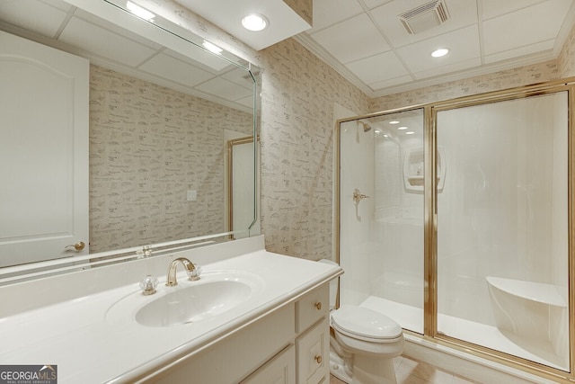 bathroom with walk in shower, vanity with extensive cabinet space, and toilet