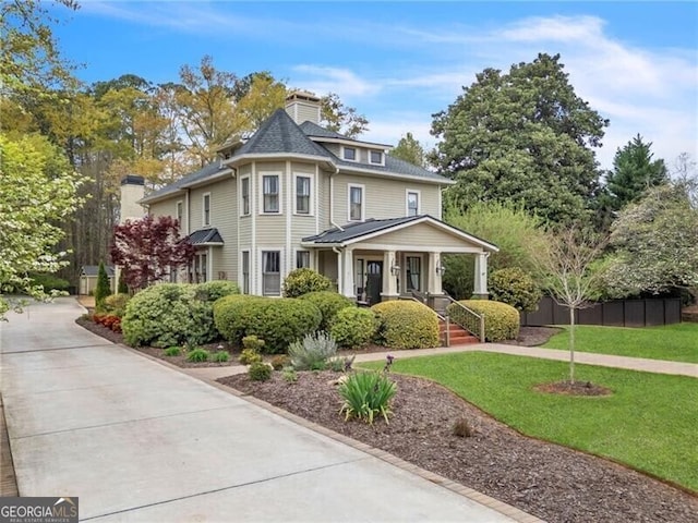 victorian-style house with a porch