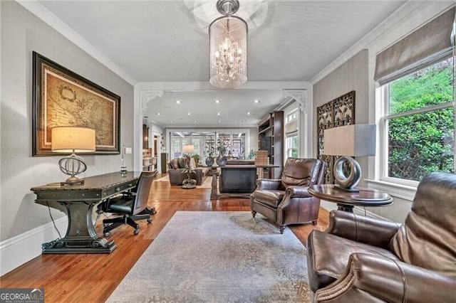 interior space featuring a chandelier, crown molding, and hardwood / wood-style flooring