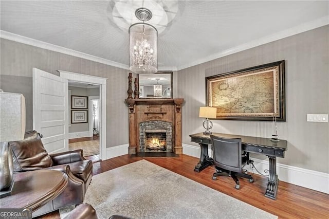 office space with ornamental molding, dark hardwood / wood-style flooring, and an inviting chandelier