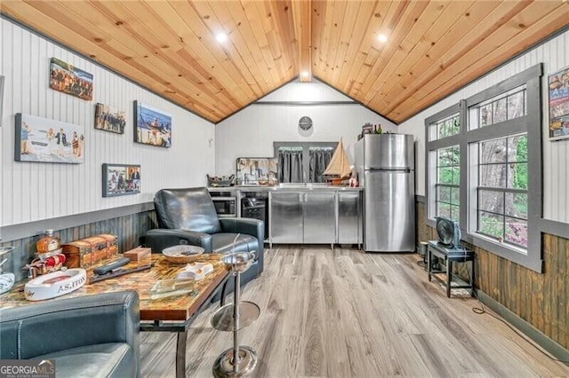 sitting room with wooden ceiling, lofted ceiling, and light hardwood / wood-style floors