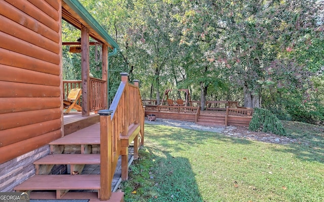 view of yard with a wooden deck