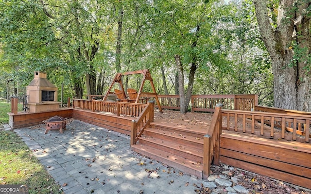 wooden deck with a patio