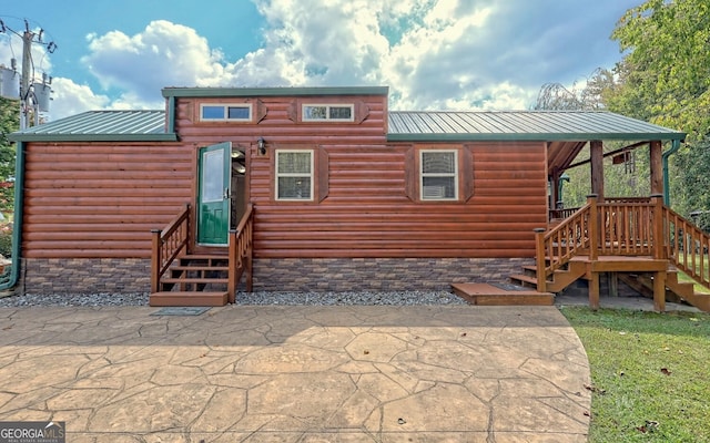 back of house with a patio area