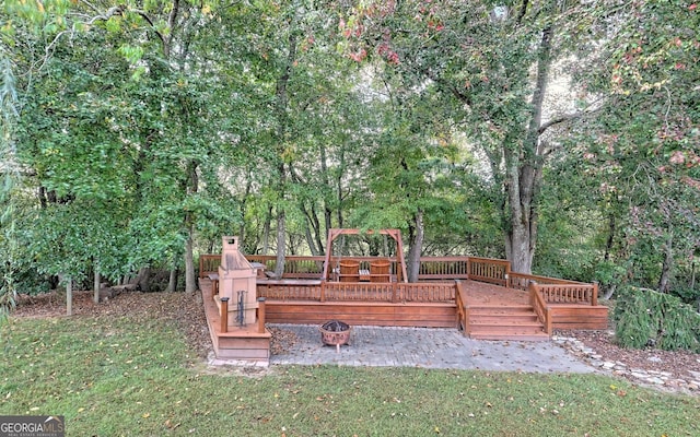 surrounding community featuring a deck and a yard