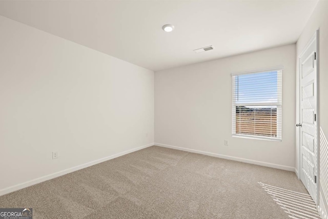 view of carpeted spare room