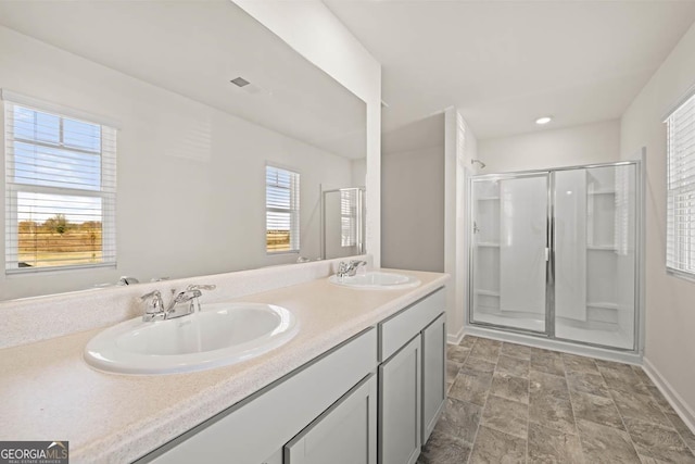 bathroom with an enclosed shower and vanity