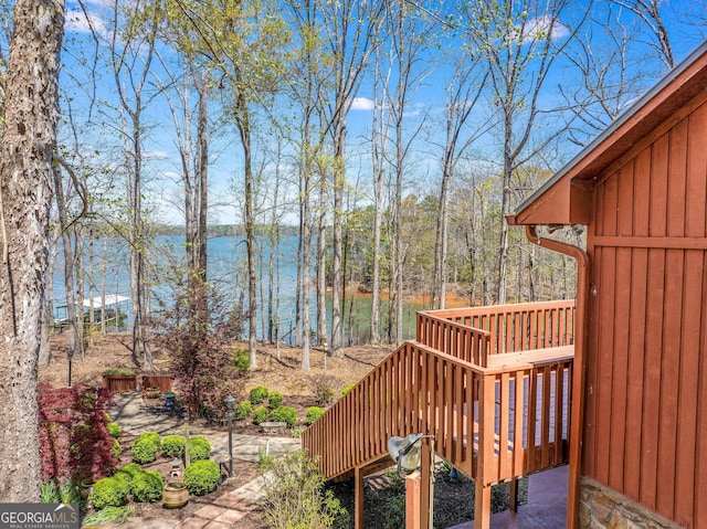 wooden deck featuring a water view