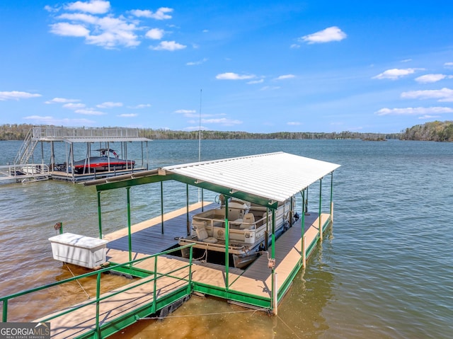 dock area featuring a water view