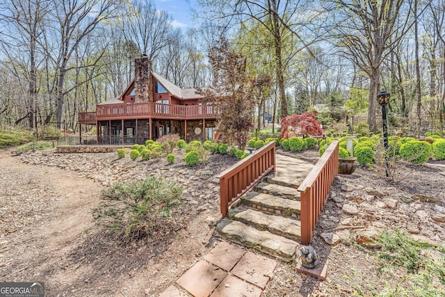 view of yard featuring a wooden deck