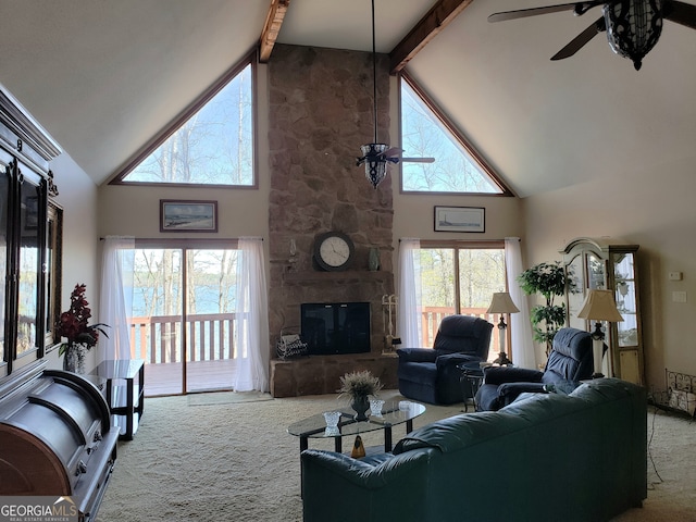 living room featuring light colored carpet, ceiling fan, high vaulted ceiling, and beamed ceiling