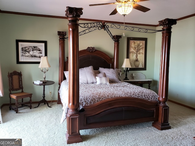 carpeted bedroom with ceiling fan and ornamental molding