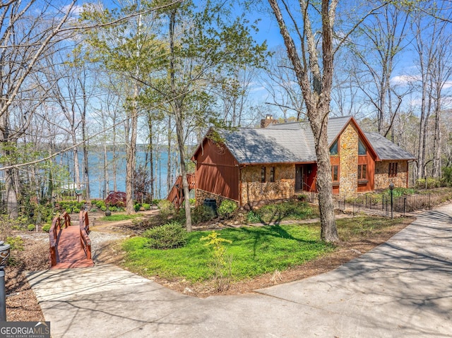 view of front of house with a water view