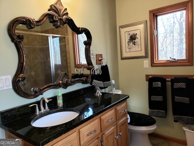 bathroom featuring toilet and large vanity