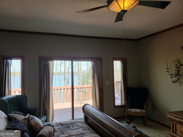 bedroom featuring carpet floors, multiple windows, ceiling fan, and access to outside