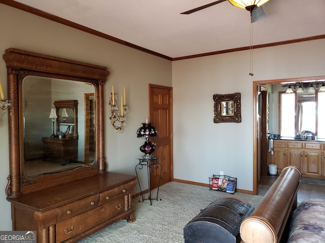 carpeted living room featuring ornamental molding and ceiling fan