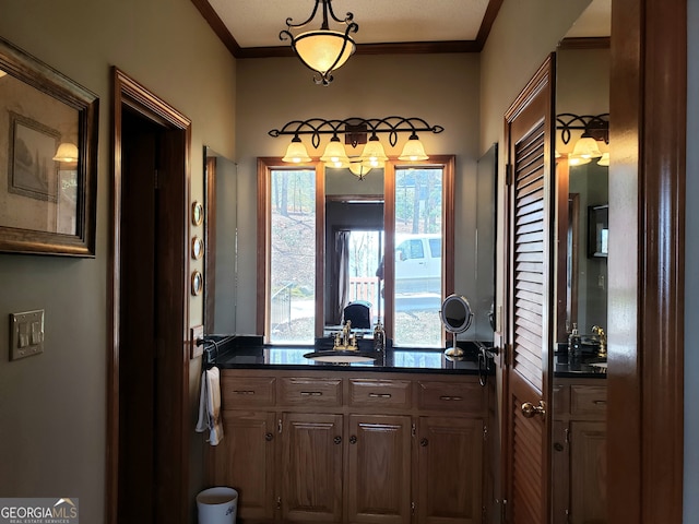 interior space featuring vanity and crown molding