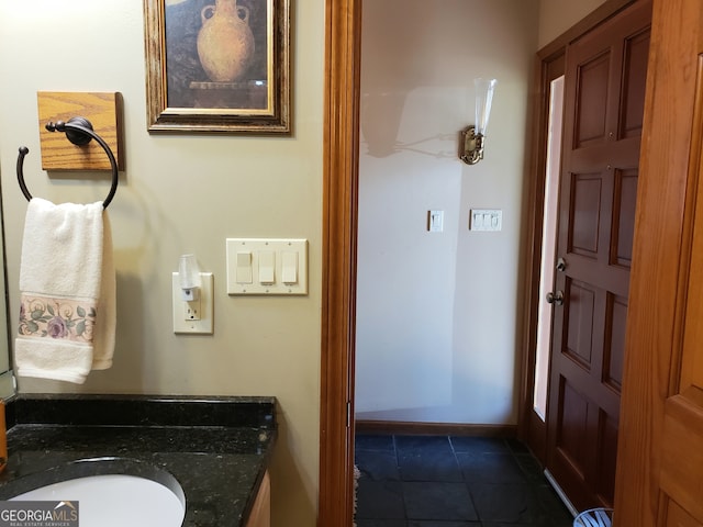 bathroom featuring vanity and tile flooring