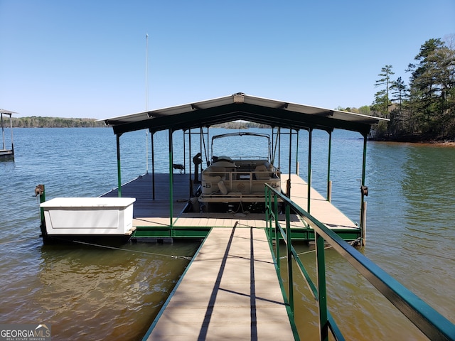 dock area with a water view