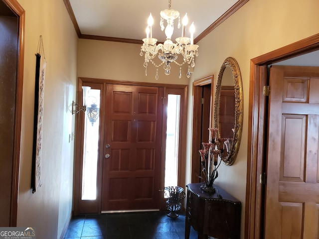 tiled entryway with a chandelier, a wealth of natural light, and ornamental molding