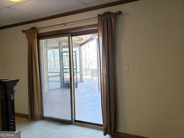 doorway featuring a paneled ceiling and light tile floors