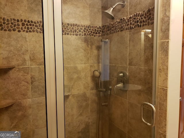 room details featuring a shower with door