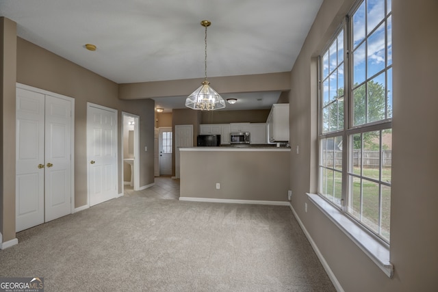 interior space featuring light carpet