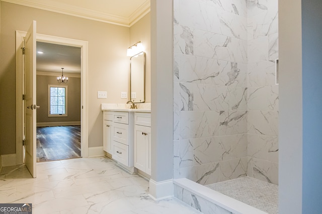 bathroom with tile floors, vanity, a chandelier, ornamental molding, and a tile shower