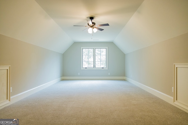 bonus room featuring ceiling fan, light colored carpet, and vaulted ceiling