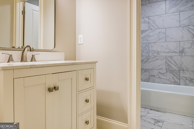 bathroom with tiled shower / bath combo, tile flooring, and vanity