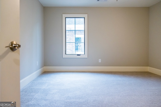 spare room with light colored carpet