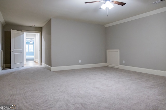 unfurnished room featuring ceiling fan and light colored carpet