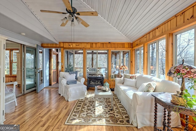 sunroom / solarium with wooden ceiling, vaulted ceiling, and ceiling fan