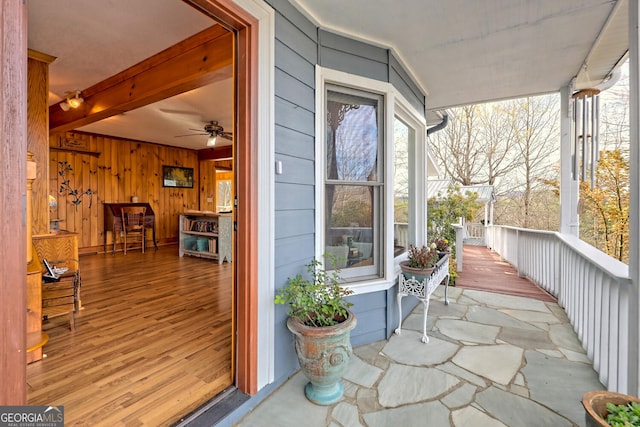 exterior space with ceiling fan