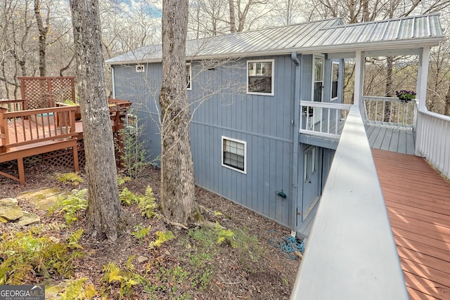 view of side of property with a deck