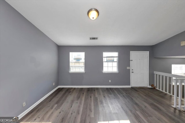 unfurnished room featuring dark hardwood / wood-style floors