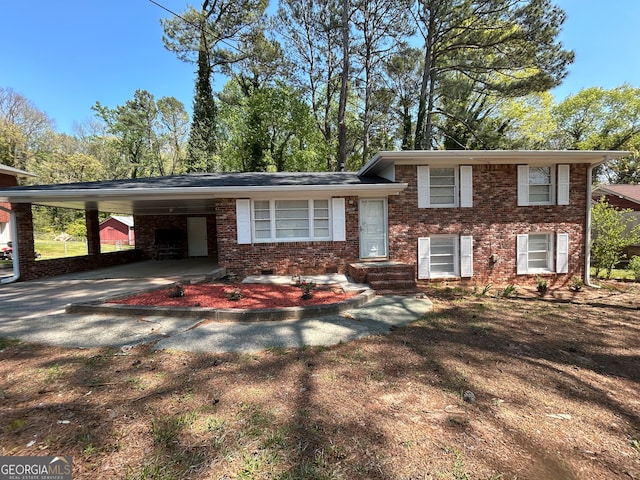 split level home featuring a carport