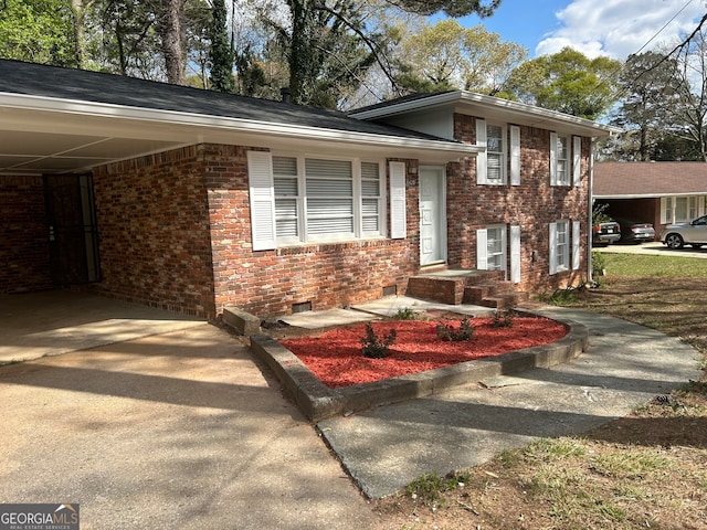 split level home with a carport