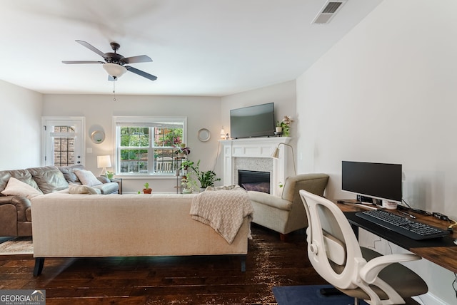 living room with ceiling fan and dark wood-type flooring