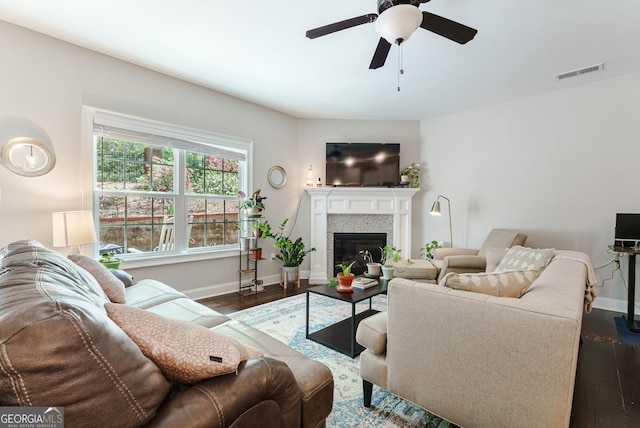 living room with dark hardwood / wood-style floors and ceiling fan