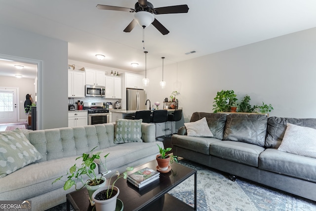 living room with ceiling fan