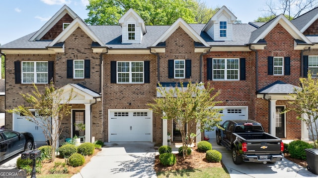 multi unit property featuring a garage