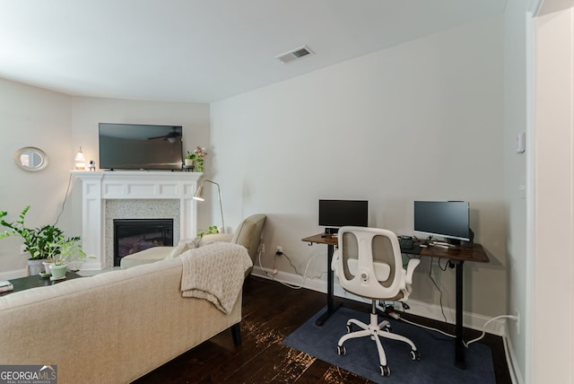 bedroom with dark hardwood / wood-style floors