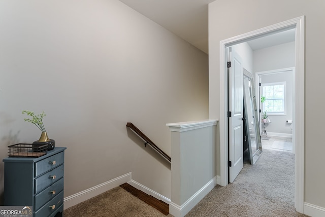 hallway with light carpet