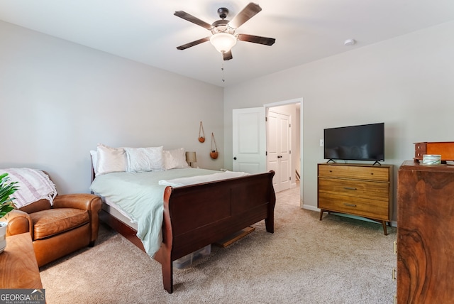 bedroom featuring ceiling fan and light colored carpet