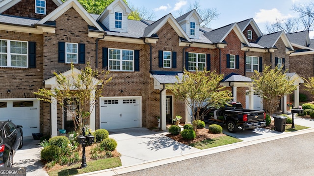 multi unit property featuring a garage