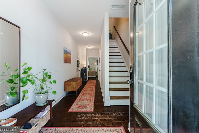 corridor with dark hardwood / wood-style floors