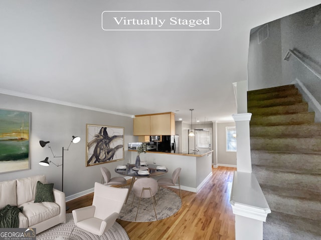 living room featuring light hardwood / wood-style flooring and crown molding